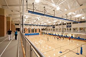 Student playing basketball in the rec center.