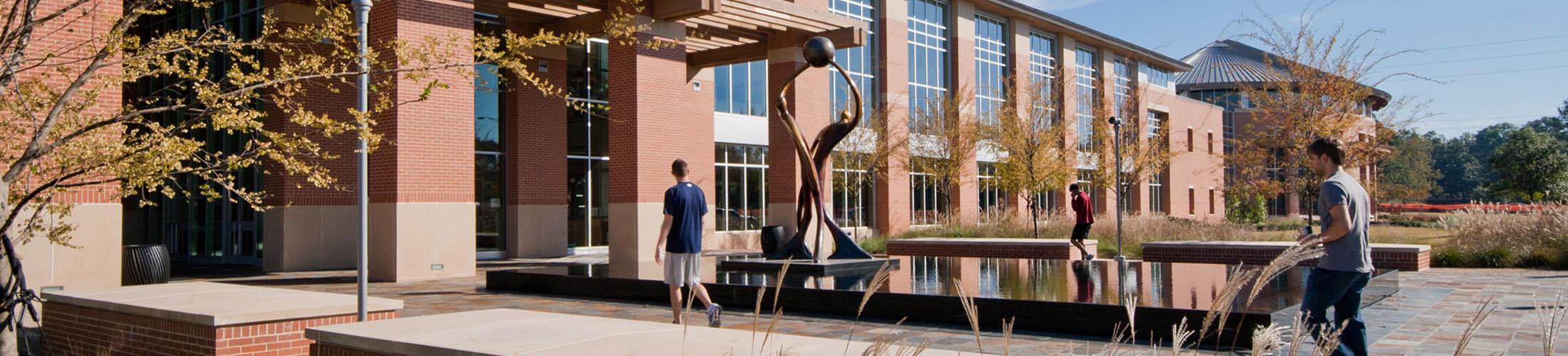 Student Recreation Center building with students walking in.